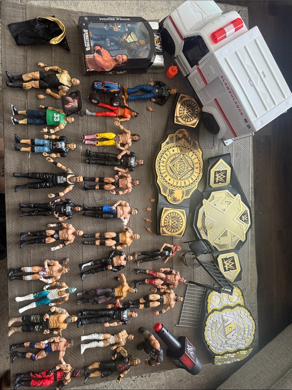 WWE Action Figure Lot with Ambulance, microphone, & 3 Gold Championship Belts